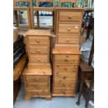 Pine narrow chest of 5 drawers, another with four drawers and another pair with each three drawers