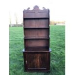 19th century mahogany and grained waterfall bookcase with scrolling top rail and graduated open shel