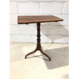 19th century elm and mahogany tilt top wine table on turned column with three splayed legs