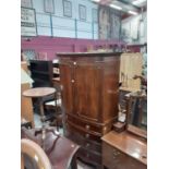 19th century mahogany bowfront wardrobe with two doors above enclosing hanging rail, two short and t