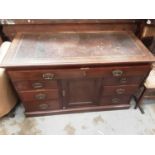 Good quality Edwardian walnut desk with leather lined top, fitted secretaire drawer and central cupb