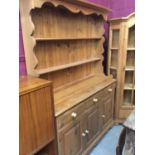 Pine two height dresser with three drawers and three cupboards 139 cm wide 194 cm high