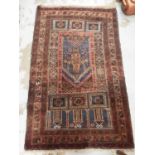Eastern rug with geometric decoration on red and blue ground, 131cm x 80cm and one other runner, 127