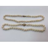 Two cultured pearl necklaces with 9ct gold clasps