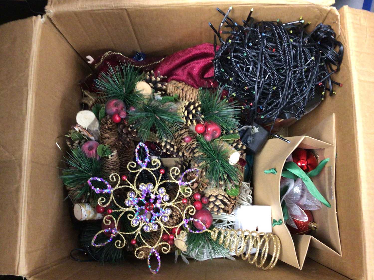 Box of Christmas decorations including lights, two cushions and Bush vintage radio