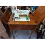 Singer sewing machine in oak case with accessories
