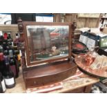 Regency mahogany bowfront toilet mirror, with three drawers to the platform base, 55cm wide