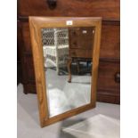 Good quality bevelled wall mirror in Ercol style elm frame 71x46cm