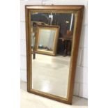 Bevelled wall mirror in maple frame with gilt slip