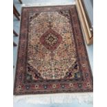 Eastern rug with geometric decoration on red, blue and beige ground, 166cm x 113cm
