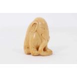Japanese carved ivory netsuke, in the form of an elephant, faint signature