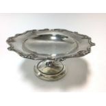 George V silver comport of conventional form with shell and scroll border, raised on pedestal foot,