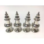 Set of four 1930s silver casters of baluster form