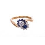 Sapphire and diamond cluster ring with a double cluster