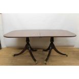 Regency style mahogany twin pedestal extending dining table