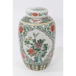 Chinese famille verte ovoid porcelain vase and cover, 19th century, decorated with panels of flowers