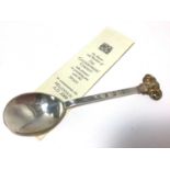 Good quality contemporary silver rail tail spoon with cast gilded Ram's head terminal, (London 2000)