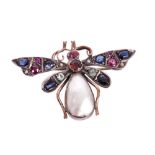 Late 19th century gold and gem-set butterfly brooch with mother of pearl body and multi-gem set wing