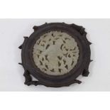 Chinese jade plaque, carved and pierced with a fisherman and scrolling foliage, in a wooden mount, 8
