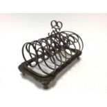 Edwardian silver six division toast rack of conventional form