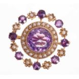 Late Victorian gold amethyst and seed pearl pendant/brooch, the circular wreath design with a centra