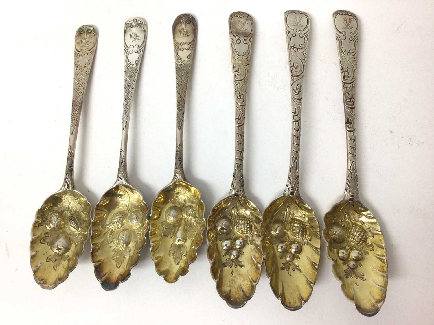 Set of three Georgian silver berry dessert spoons and three further similar