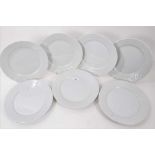 Twenty-eight Royal Copenhagen blanc de chine dinner plates, with spiral fluting and moulded basket w