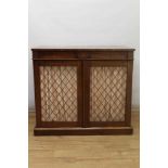 19th century mahogany chiffonier, with tablet frieze and enclosed by a pair of grille doors, on plin