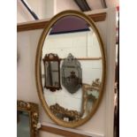 19th century oval gilt mirror with beaded decoration