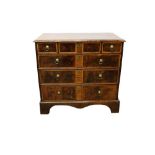 Early 18th century walnut and elm banded chest, having three short over three long graduated drawers