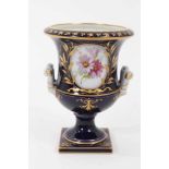 Small Berlin porcelain campana vase, circa 1880, painted with flowers on a gilt and cobalt blue grou