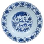 Chinese blue and white dish, 17th century, boldly painted with five deer in a landscape, the rim wit