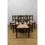 Set of six Regency style mahogany sabre leg dining chairs, each with slip on seat on reeded supports