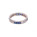 Diamond and sapphire full band eternity ring with a trio of brilliant cut diamonds alternating with