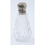 Victorian wrythen pattern cut glass toilet bottle of conical form with silver hinged cover