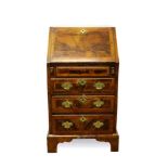 A George I style walnut crossbanded bureau of small size