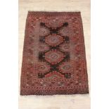 Tekke style rug, with stepped medallions on chocolate ground in multiple geometric borders, 176 x 12