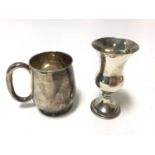 George V silver christening mug of baluster form with loop handle, on a circular foot, (Sheffield 19