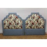 Pair of upholstered bed heads of stepped arched form, together with matching curtains