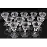 Good set of twelve 19th century wine glasses, the bowls etched with a feather and circle pattern, on