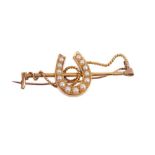 Victorian gold and seed pearl brooch in the form of a lucky horse shoe and gold riding crop, engrave