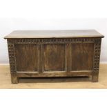 18th century carved oak coffer, with plank top triple lozenge carved panel front on stiles, 126cm wi