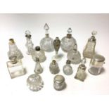 Collection of late 19th/early 20th century cut glass toilet bottles with silver mounts