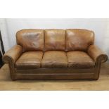 Modern tan leather three seater sofa