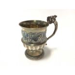 Good quality late Victorian silver christening mug with fluted decoration below a band of chased fru