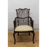 Arts and Crafts mahogany wavy stick back open armchair