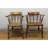 Two similar elm captain's chairs