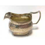 George III silver cream jug of half fluted form, (London 1811), Andrew Fogelberg.