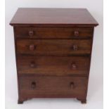Mahogany miniature chest of four graduated drawers with turned bun handles