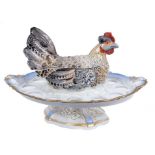 Decorative Continental novelty china egg stand by Pirkenhammer, in the form of a hen, with removable